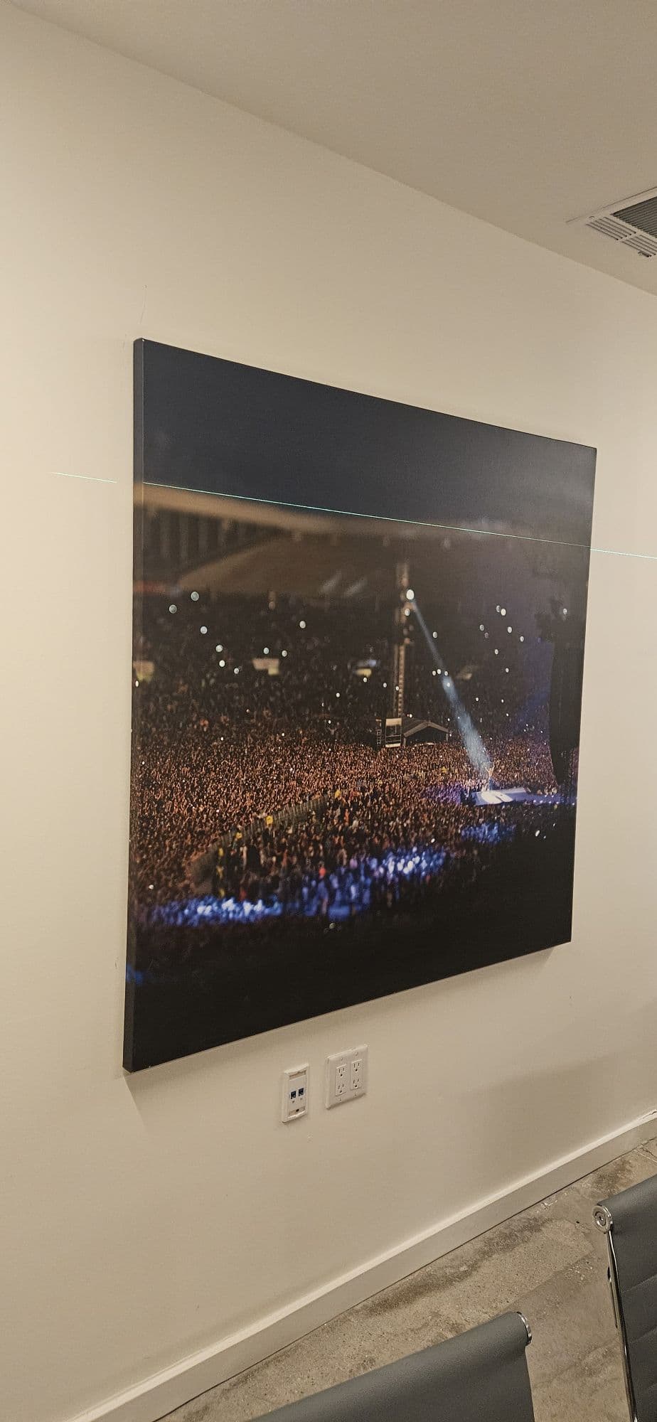 Large framed artwork mounted on wall